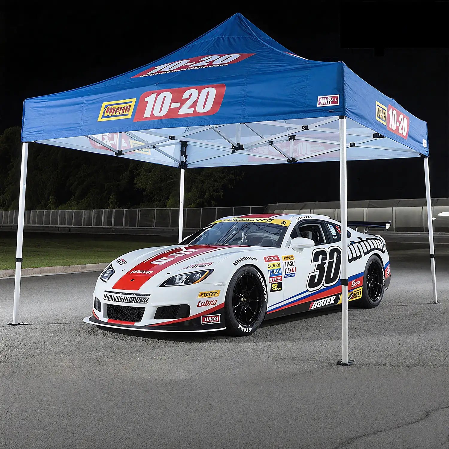 10x10 ft race event canopy with bold '10-20' branding, used at motorsport events with a race car under the tent